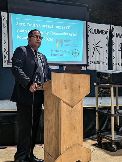 David Muhammad speaking at a round three Community Forum in 2024.